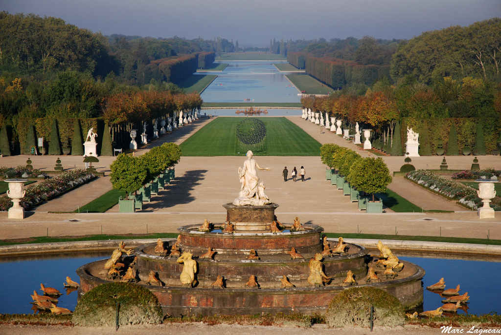 Explore the palace grounds of Versailles in France.