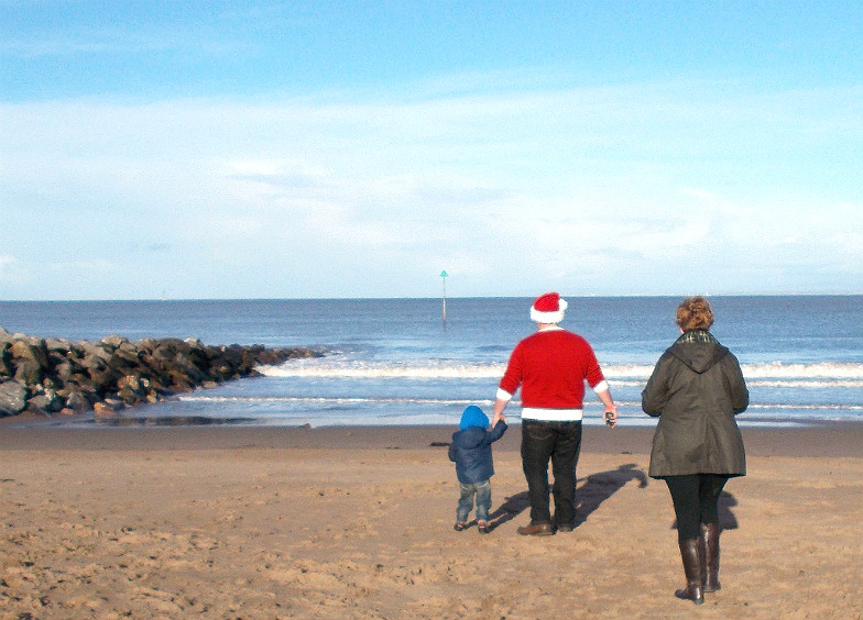 Family on a beach at Christmas