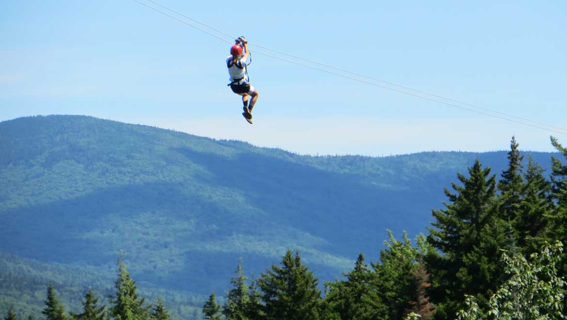 Zip line with Bretton Woods Canopy Tour at Omni Mount Washington Resort.