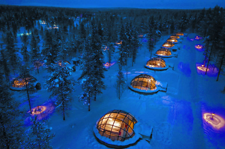 Sleep under the Northern Lights at the Kakslauttanen Arctic Resort.