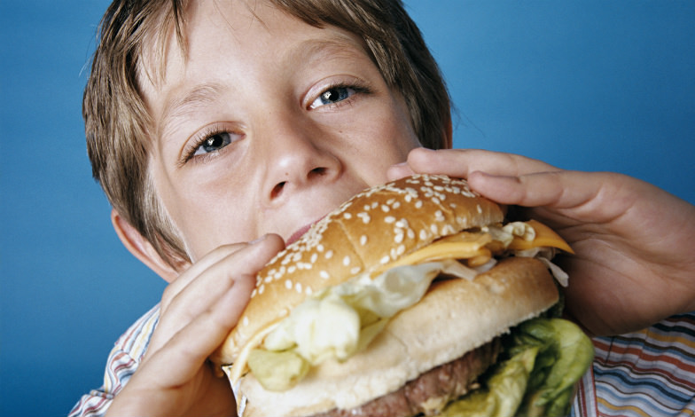 Kid Eating a Burger