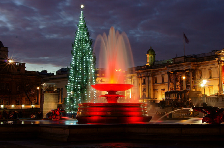 Trafalgar Square's famous Christmas tree and fountain in London