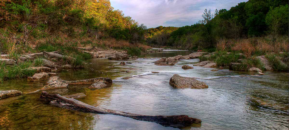 Put your feet in actual dinosaur footprints in the Paluxy riverbed where the first sauropod trackways were discovered.