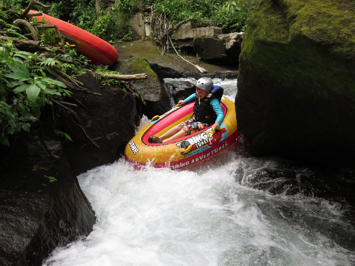 Riding the current into a secret canyon is one of the best water activities for kids in Bali.