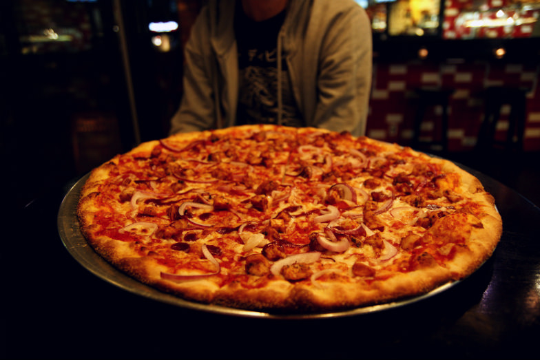 You cannot have the complete NYC experience without its traditional thin crust pizza.