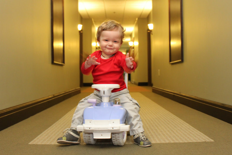 Child in a hotel hallway