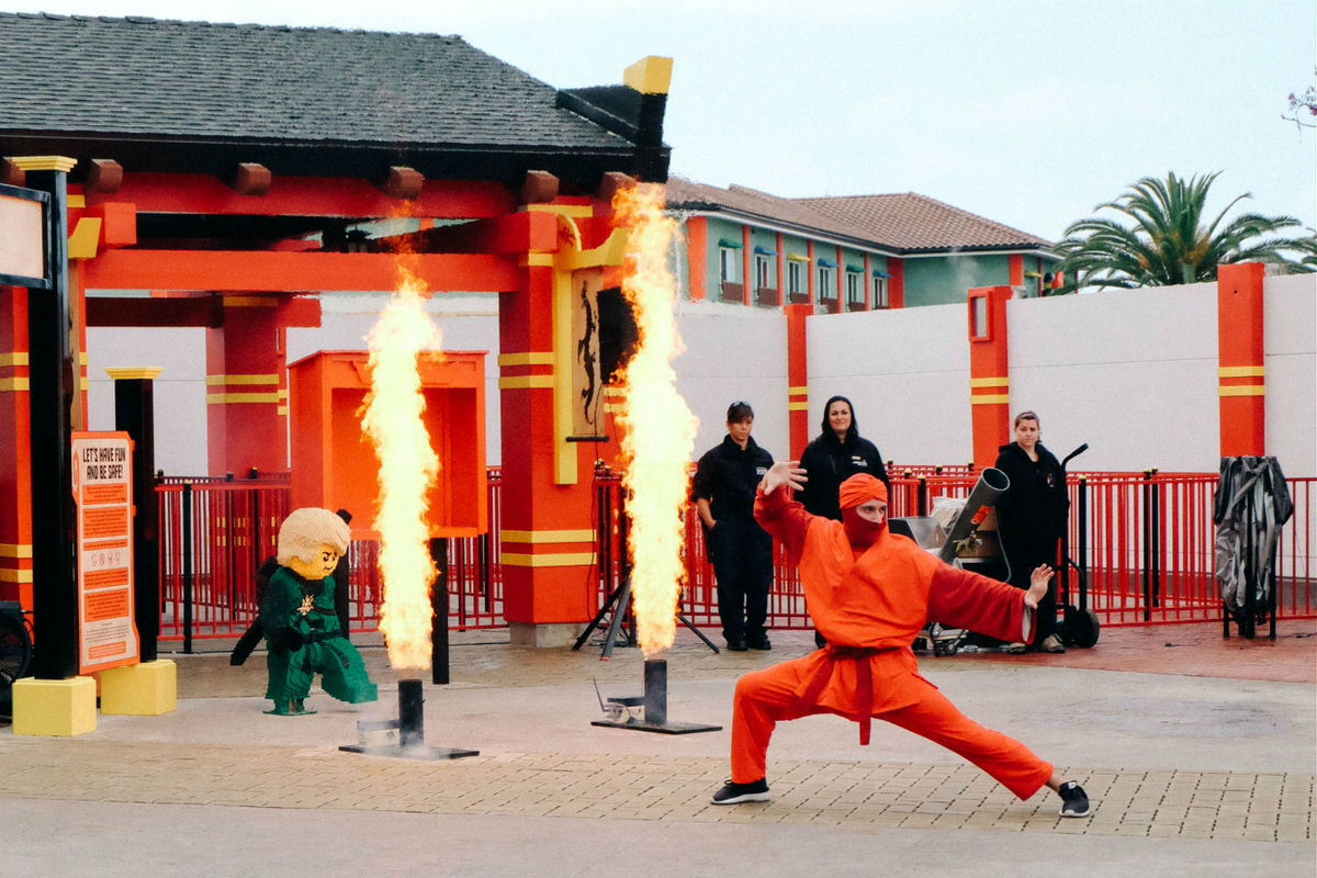 Kai, Master of Fire, showing off his skills at LEGOLAND California's NINJAGO World.