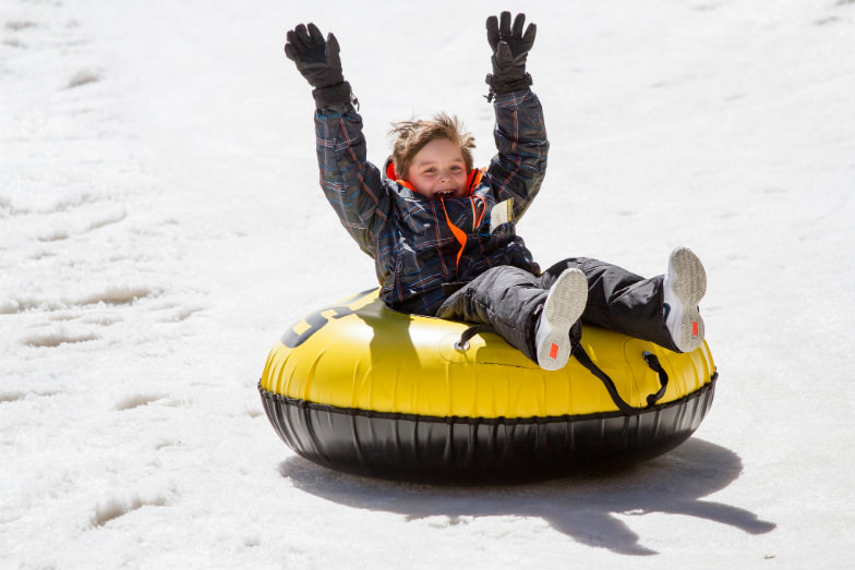 Child snow tubing at Taos Ski Valley