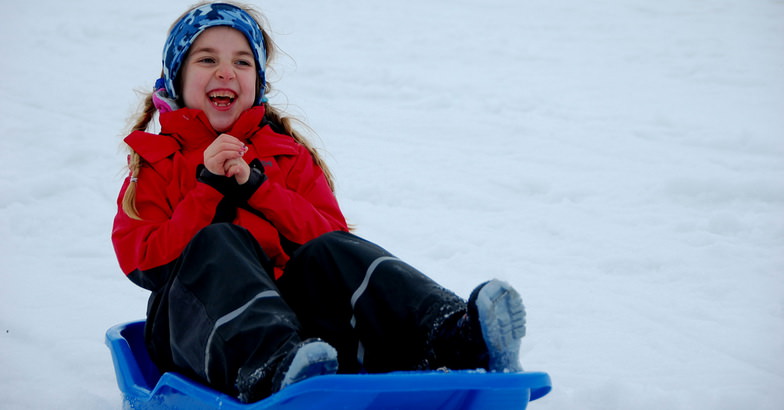 Girl Sledding