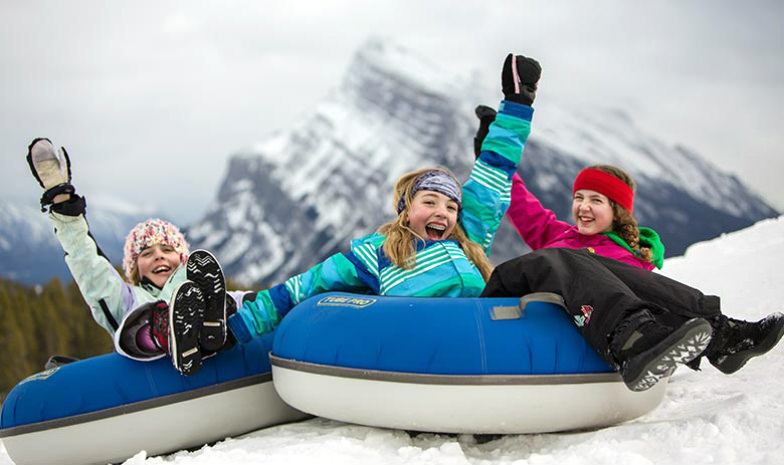 Kids snow tubing at Mount Norquay