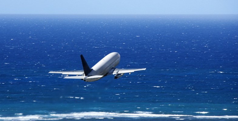 Plane Over Ocean