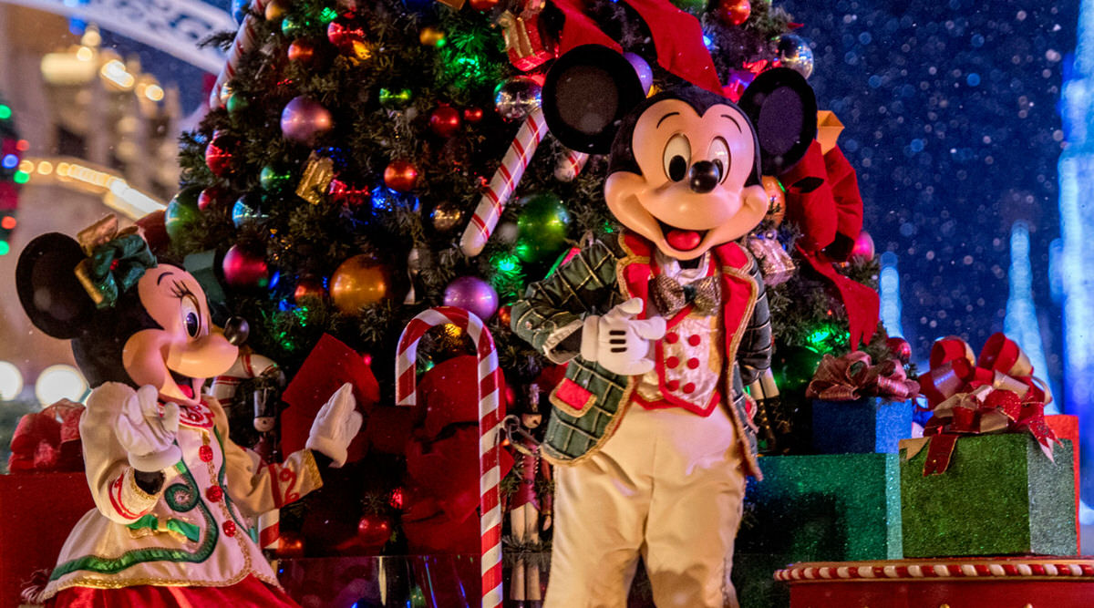 Minnie and Mickey celebrating Christmas at Disney World.